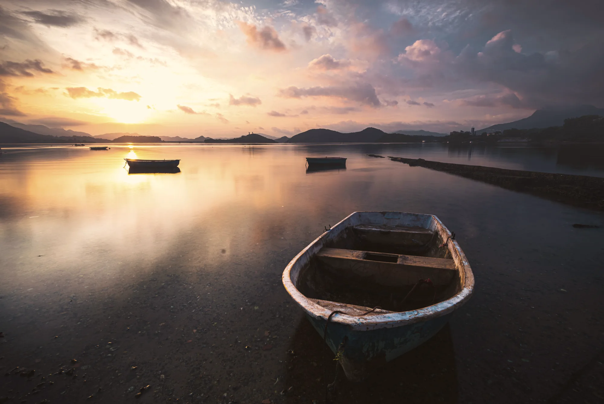 Calm lagoon at sunset with boats, Mauritius